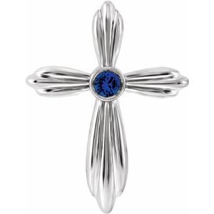 Pendentif croix en or blanc 14 carats et saphir bleu naturel