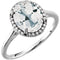 Bague en or blanc 14 carats avec topaze blanche ovale 10x8 mm et diamants (0,06 carat au total).