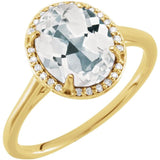 Bague en or jaune 14 carats, topaze blanche ovale 10x8 mm et diamants (0,06 carat au total).