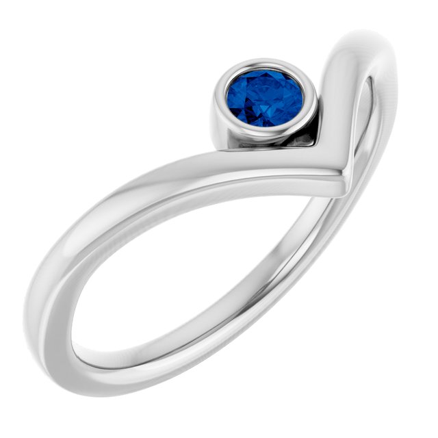 Bague en V sertie d'un saphir bleu cultivé en laboratoire et or blanc 14 carats