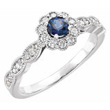 Bague en or blanc 14 carats sertie d'un saphir bleu naturel rond (0,25 carat au total) et de diamants naturels (style halo).