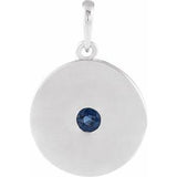 Pendentif disque en platine et saphir bleu naturel