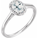 Bague en or blanc 14 carats avec topaze blanche naturelle 7x5 mm et diamants naturels (0,03 carat au total).