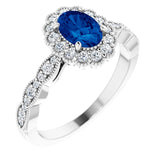 Bague en or blanc 14 carats sertie d'un saphir bleu de laboratoire et de diamants naturels (3/8 carat au total).